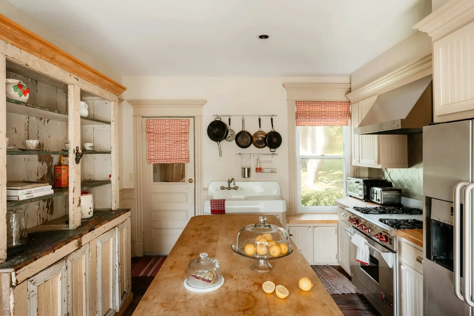 A warm, lived-in kitchen with a central work table